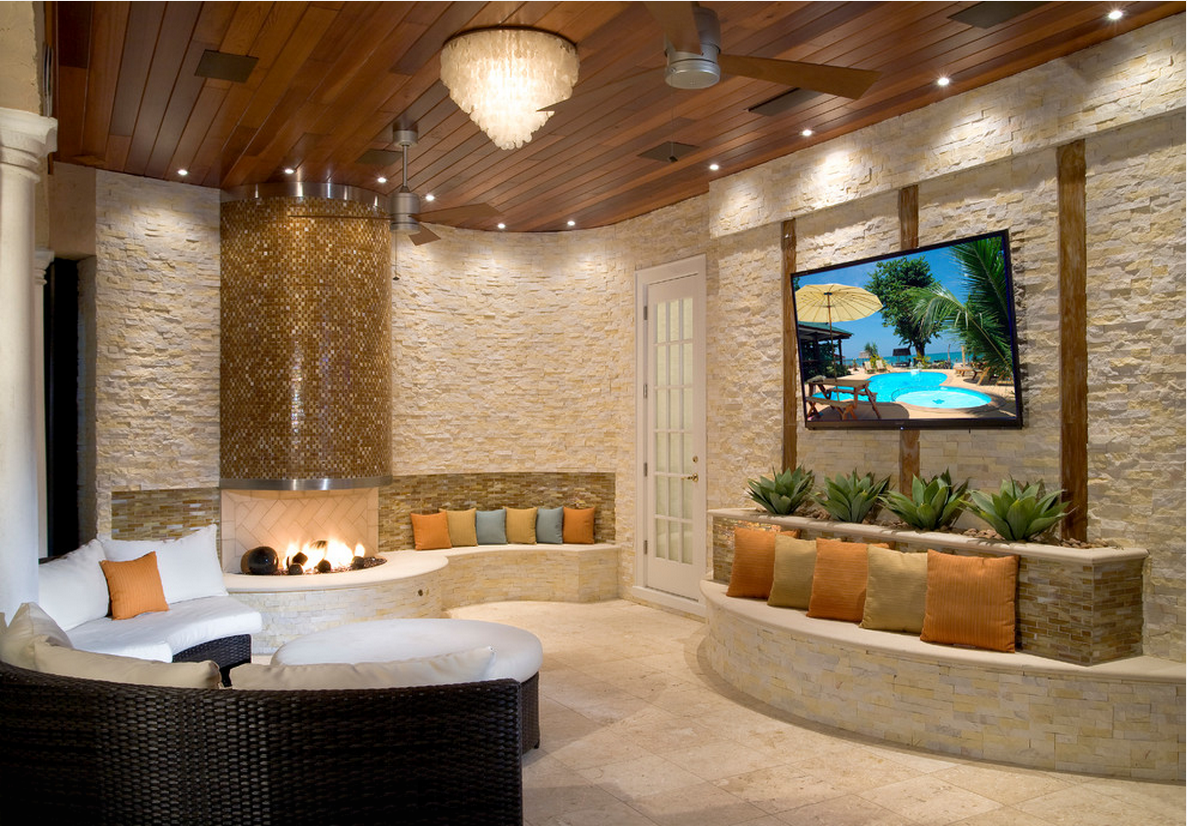 Residential Outdoor Living Space in Fort Myers, FL using Ivory Stacked Stone on a fireplace and curved walls